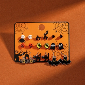 Detail of Halloween earring set featuring ghosts pumpkins and bats on an orange card