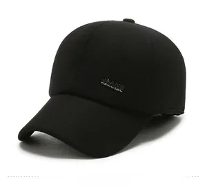 Detail shot of black wool baseball cap featuring a sleek JEANS metal logo plate