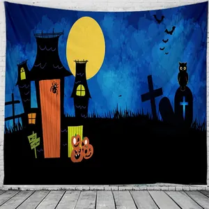 Detail of Halloween tapestry with spooky castle, moon and pumpkins on white brick wall