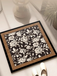 Detail of thickened absorbent bath mat with elegant black and brown rose pattern