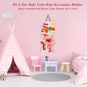 Close-up of pink felt hanging organizer filled with colorful headbands and hair bows
