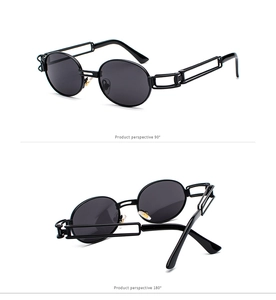 Detail view of retro steampunk sunglasses with black oval frames and hollow metal temples