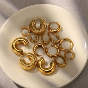Luxury gold stainless steel earring set featuring chunky hoops and teardrop designs