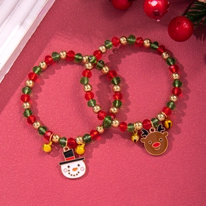 Christmas beaded bracelet set with snowman and reindeer charms on red festive background