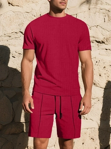 Detail of men's burgundy summer set showing waffle texture on short sleeve top and shorts