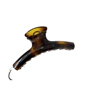Classic French amber tortoiseshell claw clip with polished gradient acetate texture
