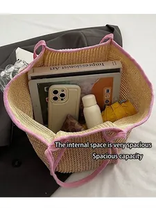 Large capacity straw tote bag with pink accents showing spacious interior storage