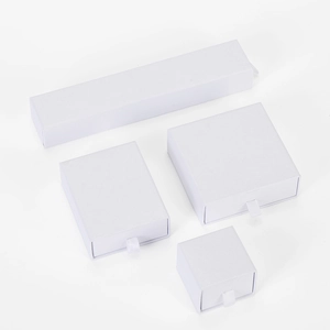 White drawer jewelry boxes in various sizes with silk ribbon pull for ring and necklace