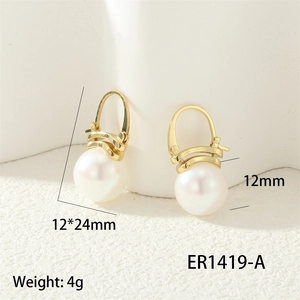 Detailed shot of 18K gold plated hoop earrings with white pearls and 12x24mm dimensions