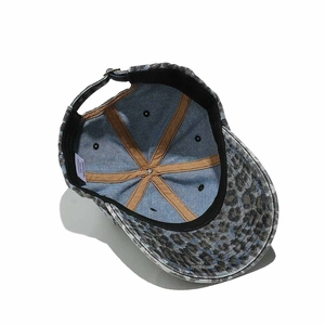 Detailed interior of leopard print cotton baseball cap showing stitching and size label