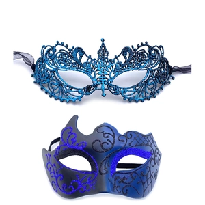 Detail of blue lace mask and gradient semi-face mask with purple glitter for masquerade
