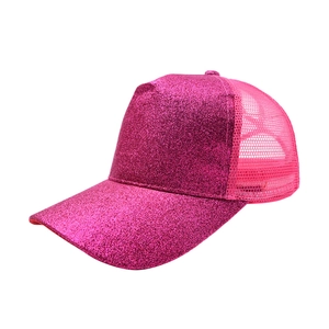 Side view of vibrant pink sequin ponytail trucker hat featuring breathable mesh backing