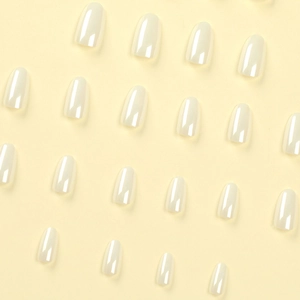 Oval white laser press-on nails with glossy finish shown in a flat lay arrangement