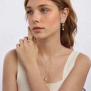 S925 silver jewelry set featuring butterfly motifs and pearls on a female model