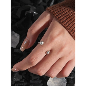 Modern S925 sterling silver irregular textured open ring on finger with dark stone