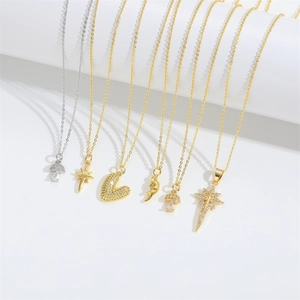 Detail view of gold and silver Radiant Star necklaces with mushroom and heart pendants