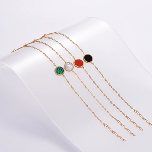 Set of four 18K gold plated stainless steel bracelets with colorful round gemstones