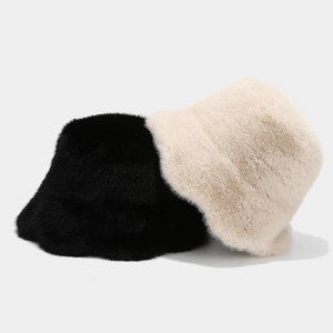 Minimalist winter ruffle bucket hat in black and off-white with plush faux fur texture