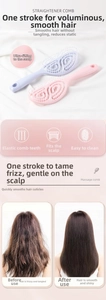 Close-up of curved vented hairbrush with ergonomic handle for scalp massage and styling