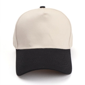 Detailed view of two-tone beige and black five-panel baseball cap with reinforced stitching