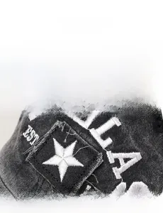 Macro view of detailed Dallas 1841 embroidery and patchwork on washed cotton baseball cap