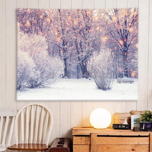 Detailed view of winter forest snow scene tapestry with warm lights and park bench
