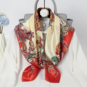 Elegant 90cm paisley satin scarf in red and cream styled on a white shirt collar