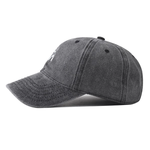 Detailed side view of washed cotton baseball cap with robot embroidery in dark grey