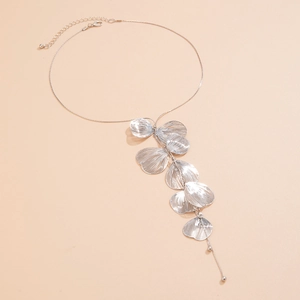 Detailed close-up of silver ginkgo leaf tassels on a metal choker necklace
