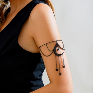 Gothic black crescent moon and star tassel arm cuff with hanging chain fringe detail