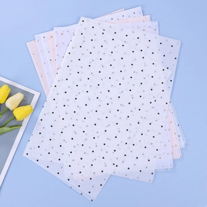 Star and polka dot patterned tissue paper sheets for gift and bouquet wrapping