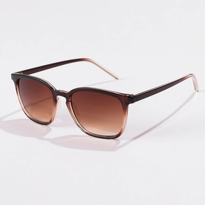 Detail view of square sunglasses with brown gradient lenses and tortoise shell frames