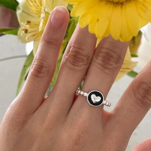 S925 sterling silver ring with black enamel drip and silver heart on finger