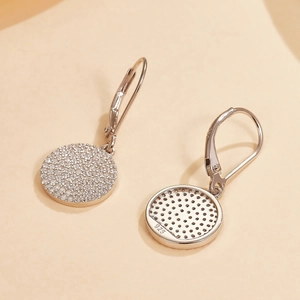 Detailed view of S925 sterling silver earrings with cubic zirconia and certification mark