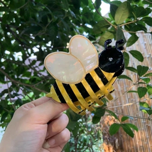 Striped bee acetate hair claw clip with pearl accents for elegant updos