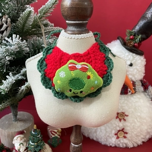 Hand-knitted Christmas pet bandana featuring a festive tree patch in red and dark green