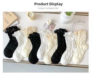 Detail of Lolita socks featuring ruffled lace edges and satin ribbons in three colors
