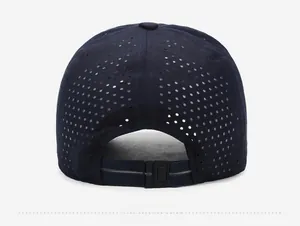Close-up of laser-cut ventilation holes and adjustable buckle on the navy sport cap