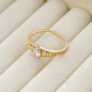 Macro detail of a vintage S925 silver ring with teardrop labradorite and gold filigree