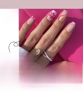 Detailed pink and yellow floral press-on nails with wave patterns and macro view