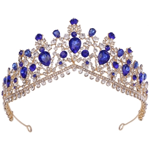 Elegant gold bridal crown featuring vibrant blue teardrop crystals and sparkling rhinestones