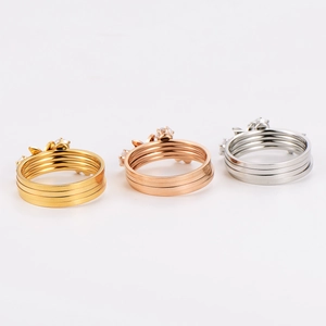 Three-piece multi-layer stackable stainless steel rings set with small crystals