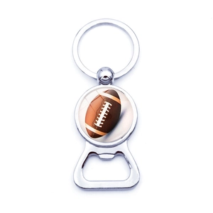 Detail of silver bottle opener keychain featuring a brown American football circular inlay