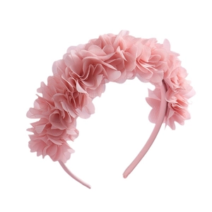 Elegant pink floral headband with soft fabric petals for a feminine and sweet look