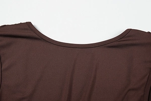 Detailed view of brown dress neckline featuring high-quality double-needle stitching