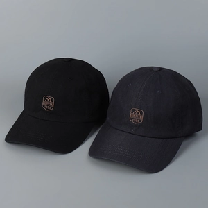 Detailed embroidery patch with mountain logo and text on cotton baseball caps