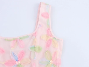 Close-up of pink mesh dress with 3D floral embroidery and sparkling sequins detailing