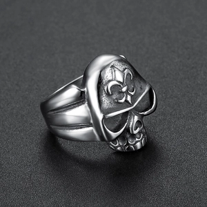 Gothic stainless steel skull ring featuring a detailed fleur-de-lis engraving in silver tone