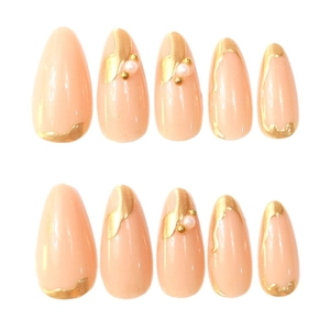 Elegant nude pink almond press-on nails with golden gilding and pearl embellishments