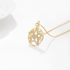 Gold MAMA star heart pendant necklace with shimmering zircon stones on white background